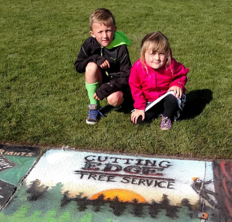 Cutting Edge Tree Service community chalk art at a local Eureka Humboldt County event with kids enjoying the day